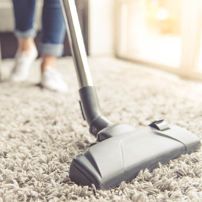 Woman cleaning her house